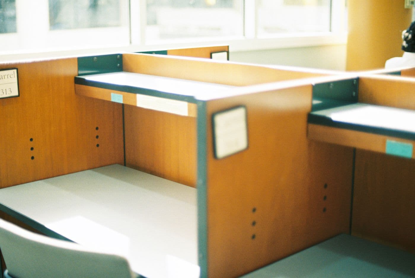 Tidy office workstations beside a large bright window