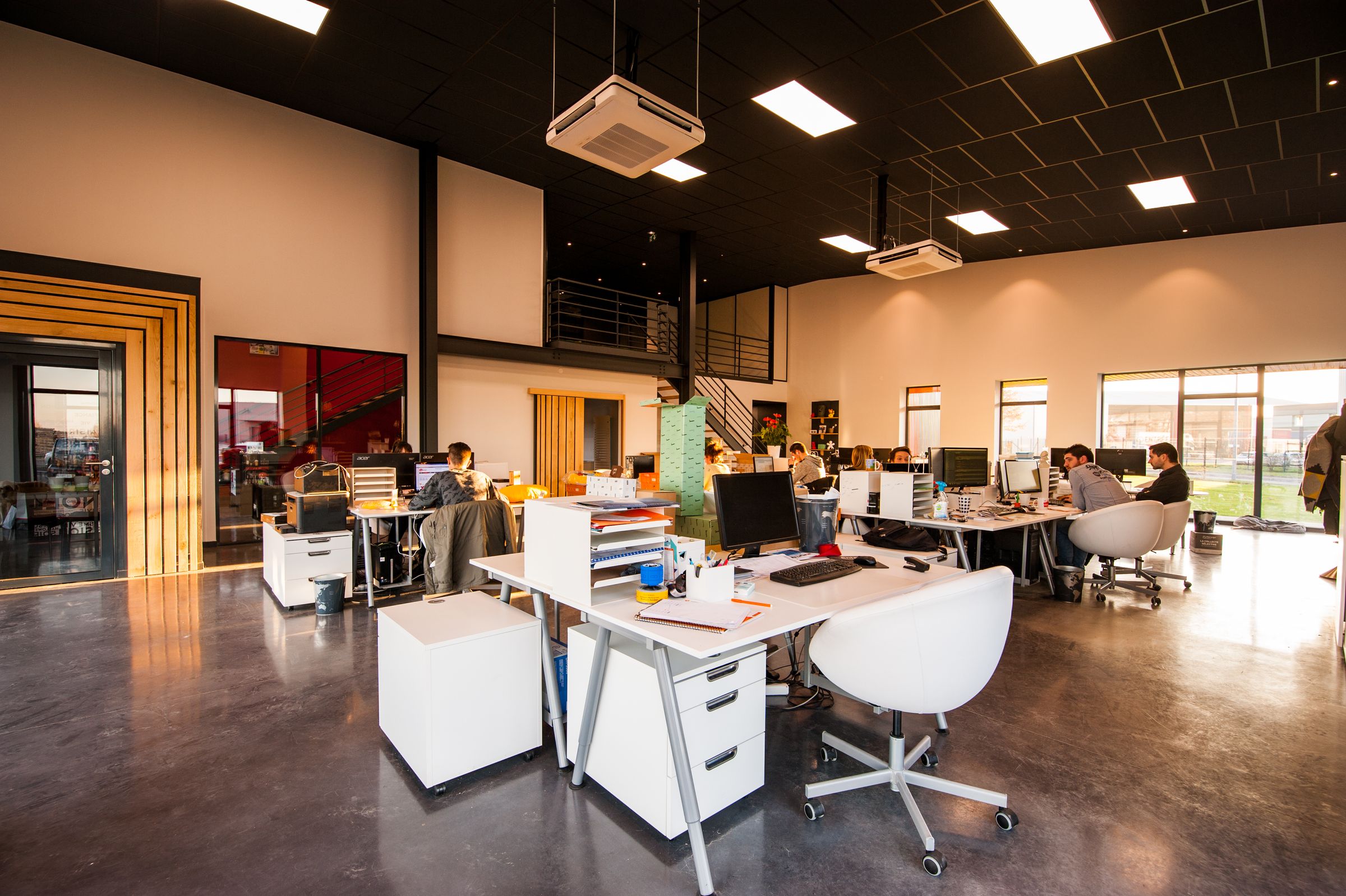 Contemporary office floor with clean workstations and meeting areas