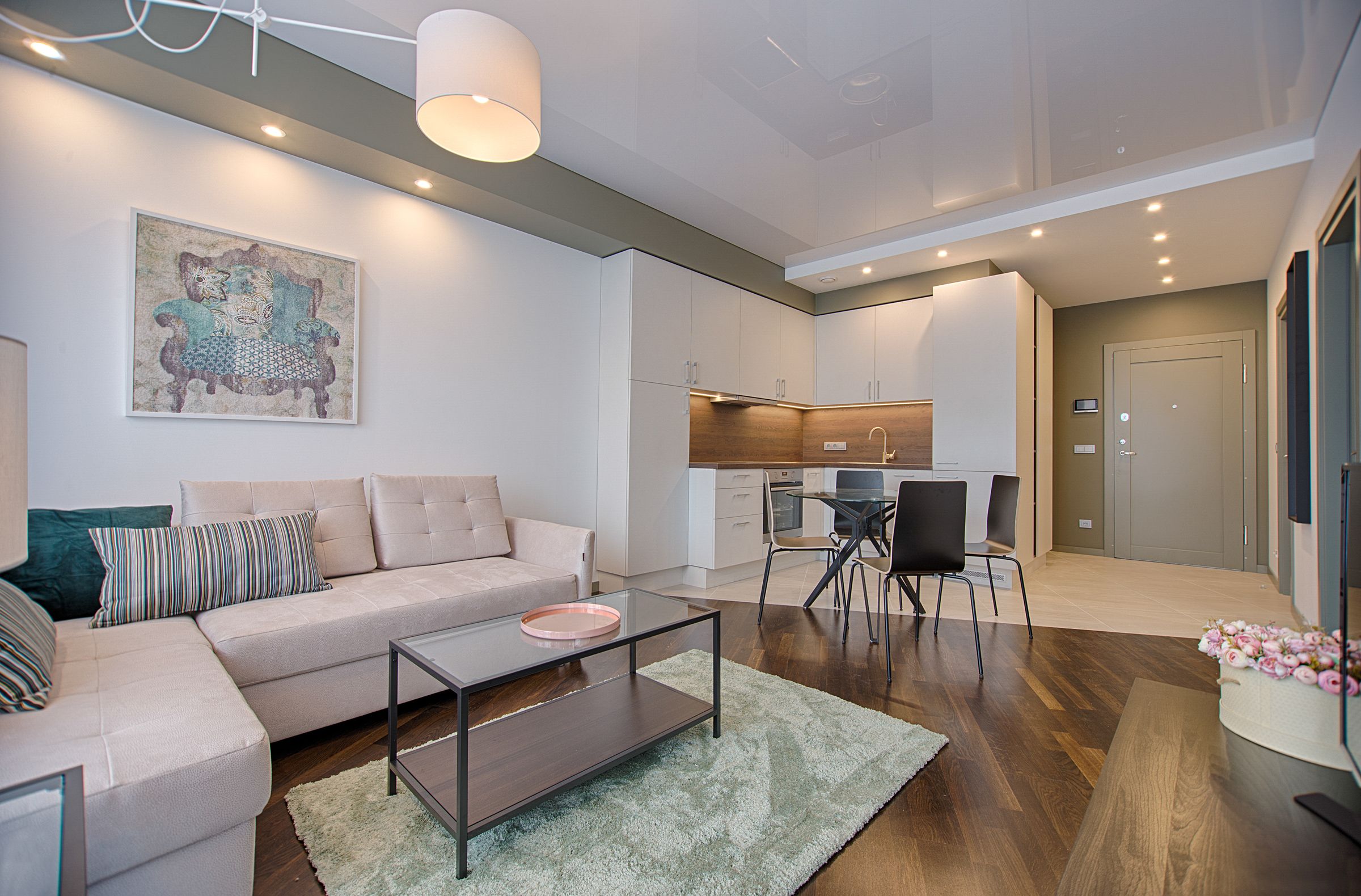 Bright contemporary condo living room with an open kitchen